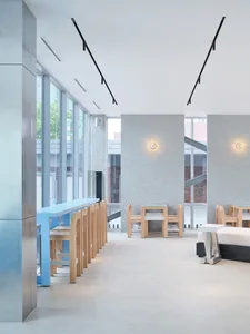 A minimalist restaurant interior with wood accents.