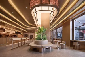 A modern coffee shop featuring glass and steel materials.