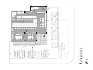 Floor plan of an industrial-themed restaurant featuring concrete elements and open seating.