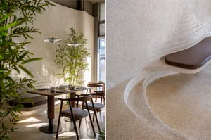 Modern restaurant interior with concrete flooring and seating
