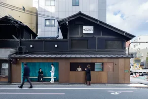 Urban, traditional storefront with wooden exterior and traditional Japanese signage