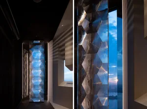 Modern office space featuring glass columns with reflective surfaces