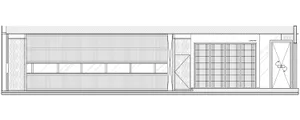 Modern office space with metal panelling and large windows.