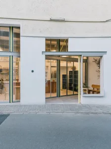 A modern retail storefront with large glass windows and a sleek, minimalist design.