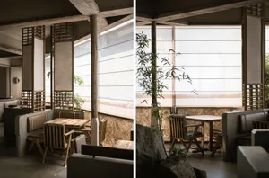 Casual restaurant interior with wooden tables, concrete accents, and large windows