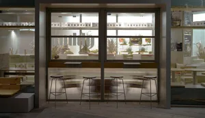 Modern bar with a glass counter and stools