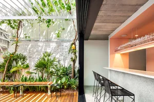 Contemporary coffee shop featuring a sleek stone bar counter