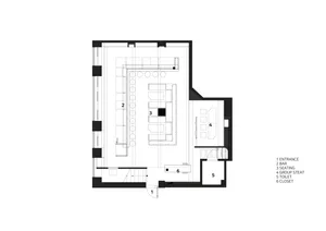 Floor plan of a modern office layout with clear zones, open seating, and a central work area.