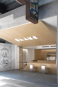 Modern coffee shop with an industrial-style counter made of wood.