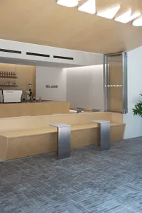 A modern coffee shop interior featuring wooden elements.