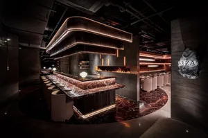 An industrial-style restaurant with a modern marble countertop