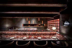 A sleek, modern restaurant interior with a luxurious marble countertop.