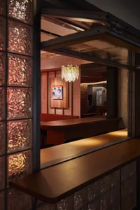 Modern restaurant with glass block walls and wooden counter