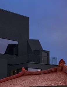 A modern, minimalist architectural design featuring concrete materials and clean lines.