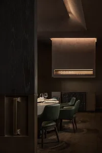 Modern industrial-style restaurant interior with metallic furniture and minimalistic design