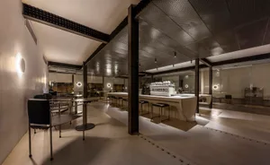 Modern, minimalist coffee shop interior with metal cladding