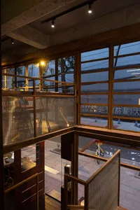 A modern storefront with wooden elements and a glass front.
