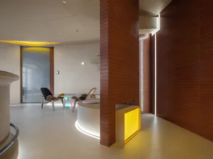 A modern office lobby featuring contemporary design elements and materials.