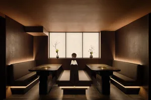 Cordovan leather restaurant interior with traditional Japanese seating and modern fixtures.
