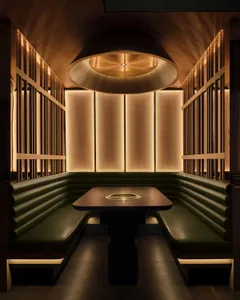 A modern interior space with wooden and leather elements.