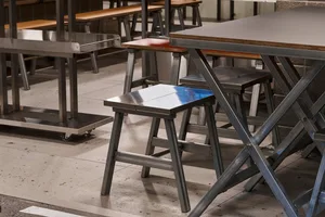 Industrial-style metal stools and tables