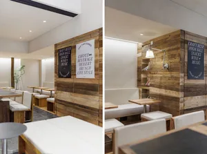 Interior view of a restaurant with wooden walls and seating arrangements.