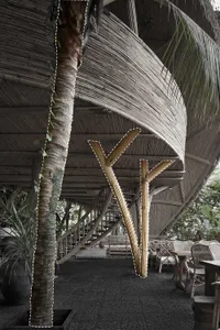 A modern interior space featuring a bamboo curtain construction