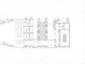 A detailed 2D architectural drawing of a modern office space showing various rooms and functional zones.