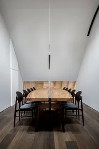 Interior of a modern conference room featuring a wooden conference table.