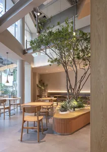 A minimalist restaurant interior featuring wood materials and modern design.