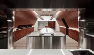 A modern conference room featuring straight lines and a straight wood floor.