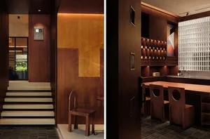 A modern restaurant interior featuring wooden paneling and natural light.