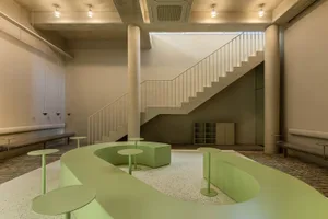 Industrial-style coffee shop interior with concrete and glass elements
