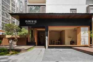 A sleek modern commercial interior with wooden accents, featuring a storefront with large windows and a minimalist design.