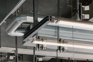 An overhead view of an industrial lighting system made of metal.