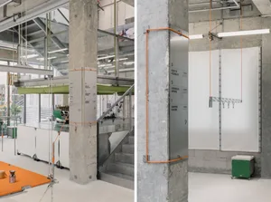 A photograph showcasing an industrial space featuring concrete columns and minimalist design.
