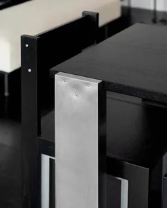 Industrial-style furniture featuring a metal frame and black finish, highlighting the modern and minimalist design.