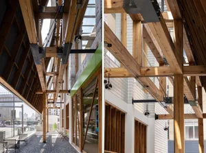 Modern industrial office space featuring wooden frames and steel structural elements.
