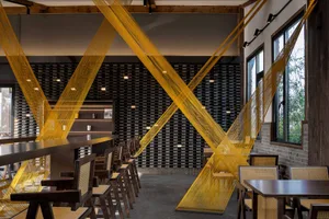 Modern restaurant interior design featuring contemporary materials and minimalist aesthetic