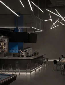 A modern industrial bar with metal, glass, and concrete elements.