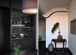 Modern living room with wooden furniture, concrete walls, and glass shelving displaying decorative items.
