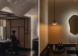A modern restaurant interior with minimalist design elements, featuring wooden partitions, metal accents, concrete floor, and