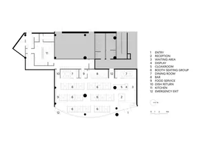A technical drawing of a restaurant layout, showing various functional zones and seating arrangements.
