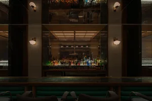 A sleek, modern bar counter with a marble top.