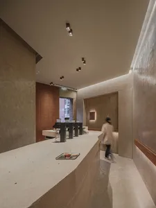 A concrete counter in an industrial-style coffee shop