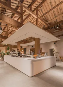 Indoor coffee shop featuring exposed wooden beams and modern fixtures.