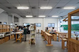 Industrial-style coffee shop with wooden tables and shelves