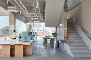 Modern office space with concrete, metal, and glass materials