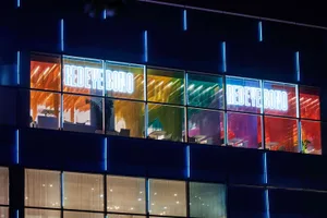 A modern office interior with colorful windows and a glass facade.