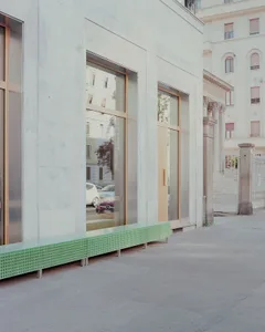 Modern storefront with glass cube seating area